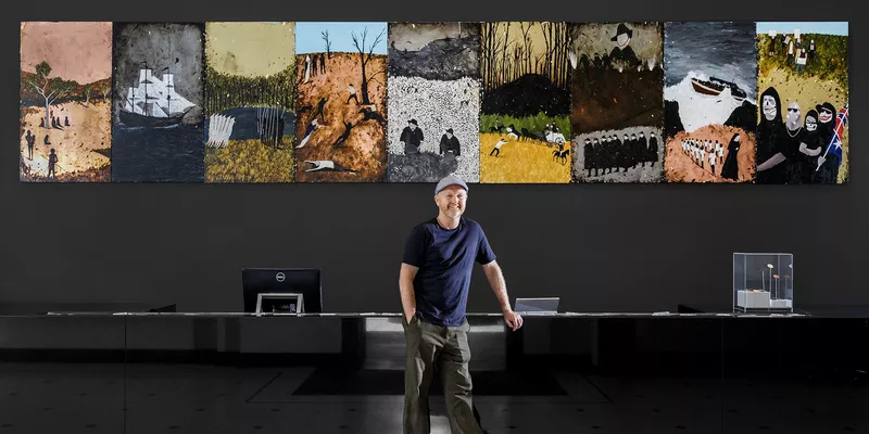 2019 Ramsay Art Prize Judge, Richard Lewer standing in front of his installation 'The History of Australia'