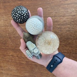 A collection of objects held in one hand