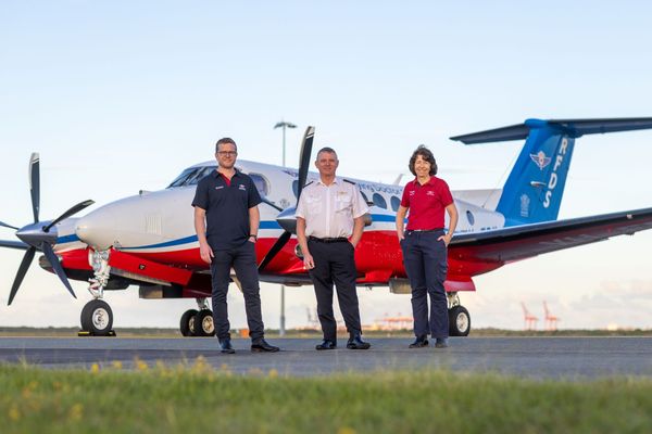 Doctor, Pilot, and Nurse stand in front of the B360 aircraft