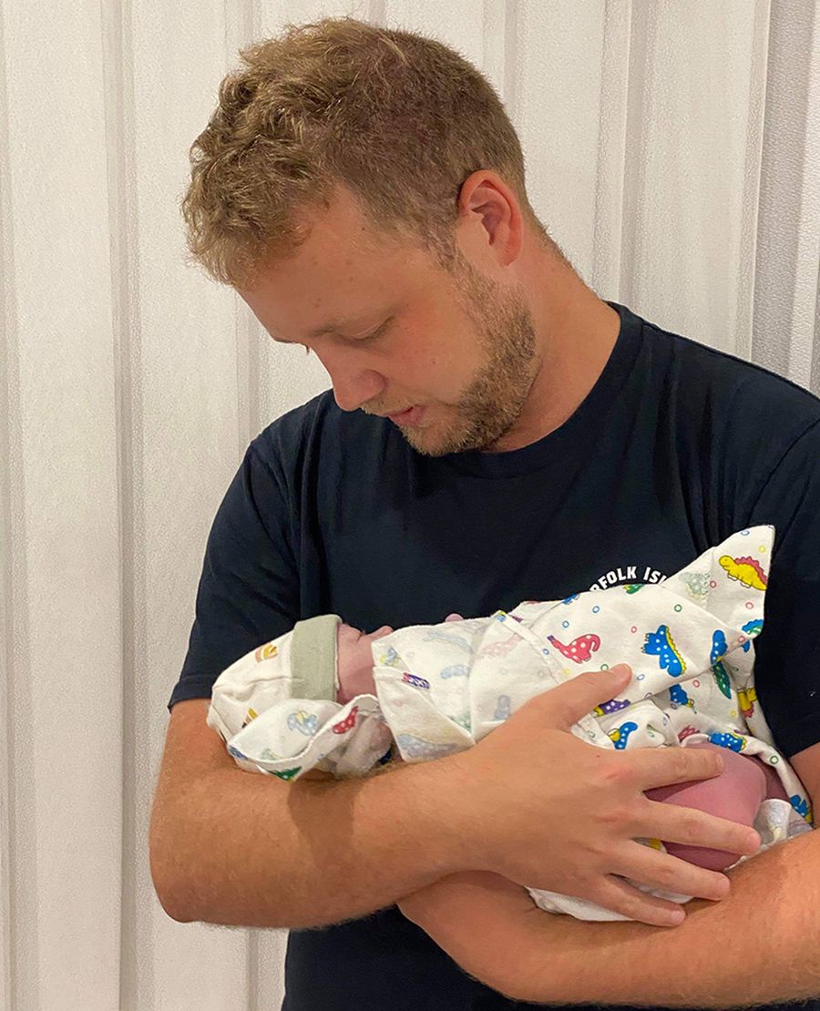 RFDS (Queensland Section) Flight Nurse Hayden Wilson with his newborn daughter