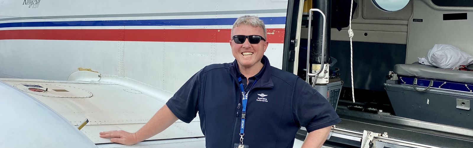Michael Cooke in front of plane 