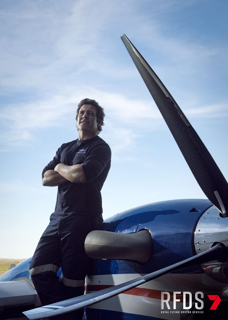 Stephen Peacocke in front of a plane