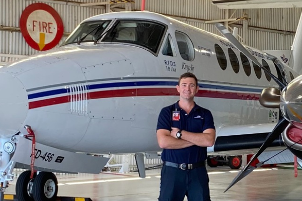 Brady in front of aircraft
