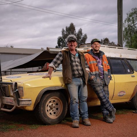 Two Trekkers leaning against their car