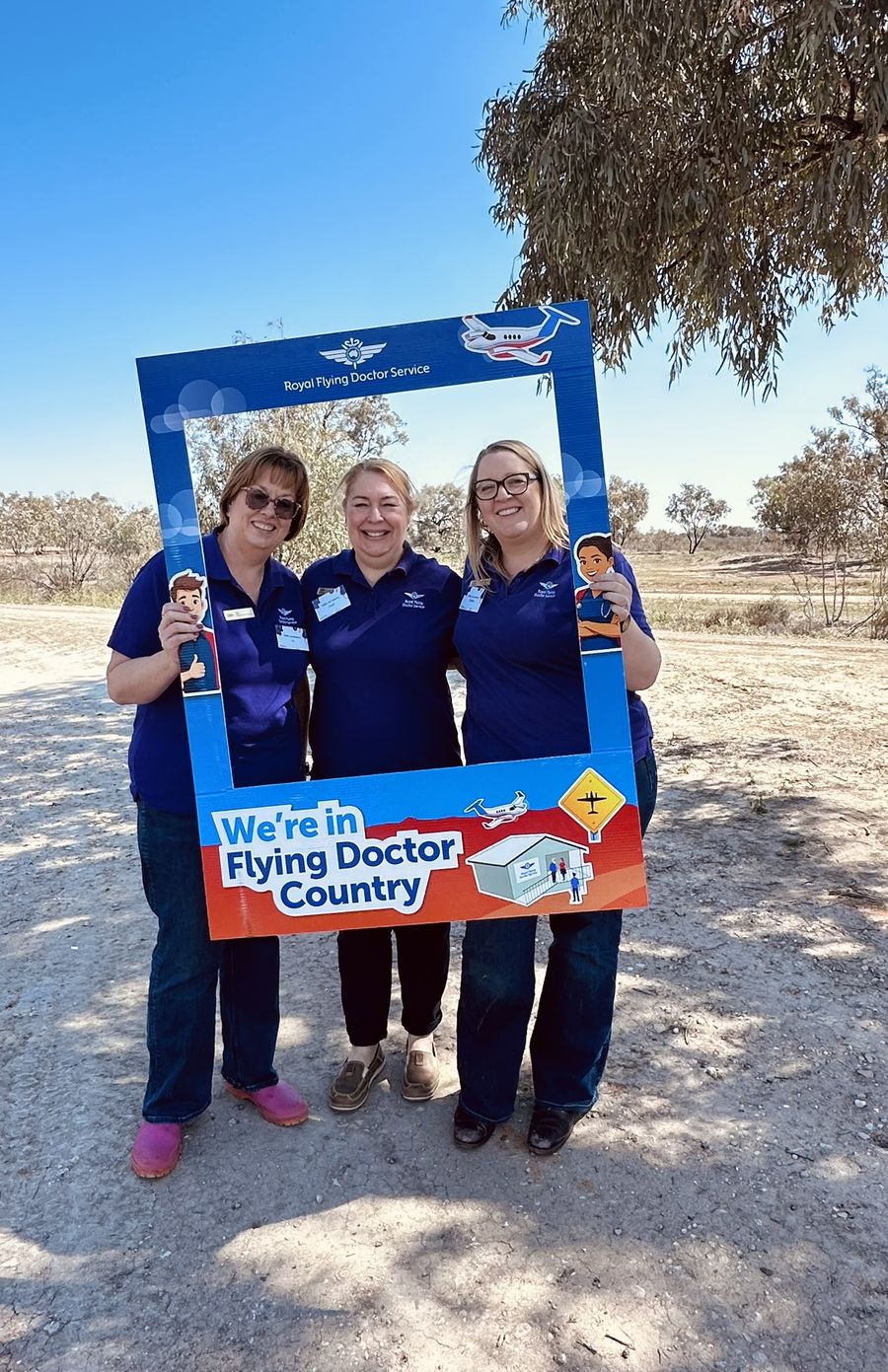 RFDS staff smiling outside the women's health clinic