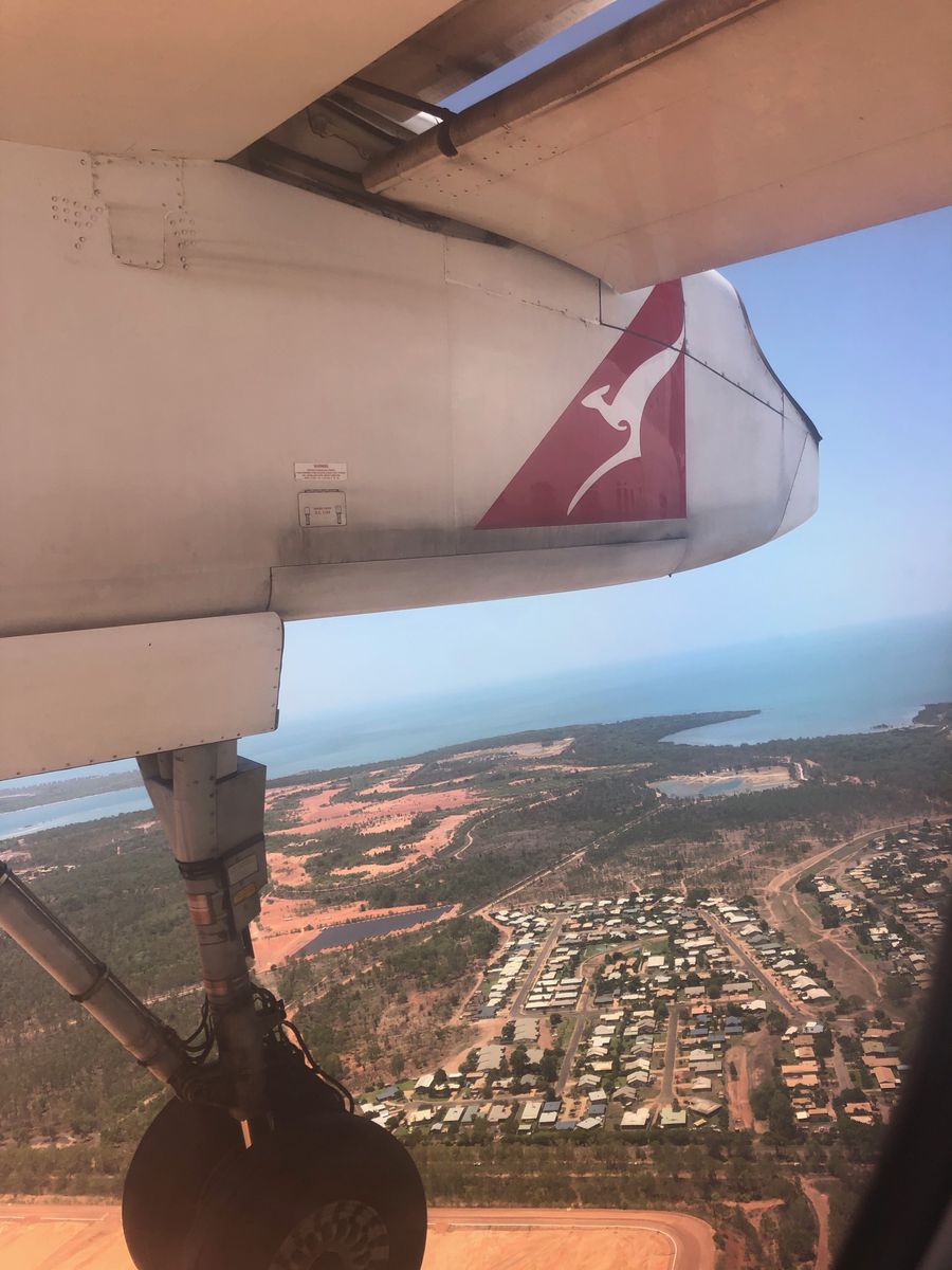 In the air shot of Qantas Plane over remote community