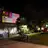 photo of collage projected on wall in forecourt after dark