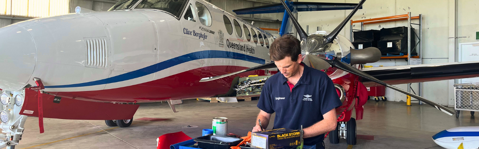 Engineer, Nic in working in front of aircraft