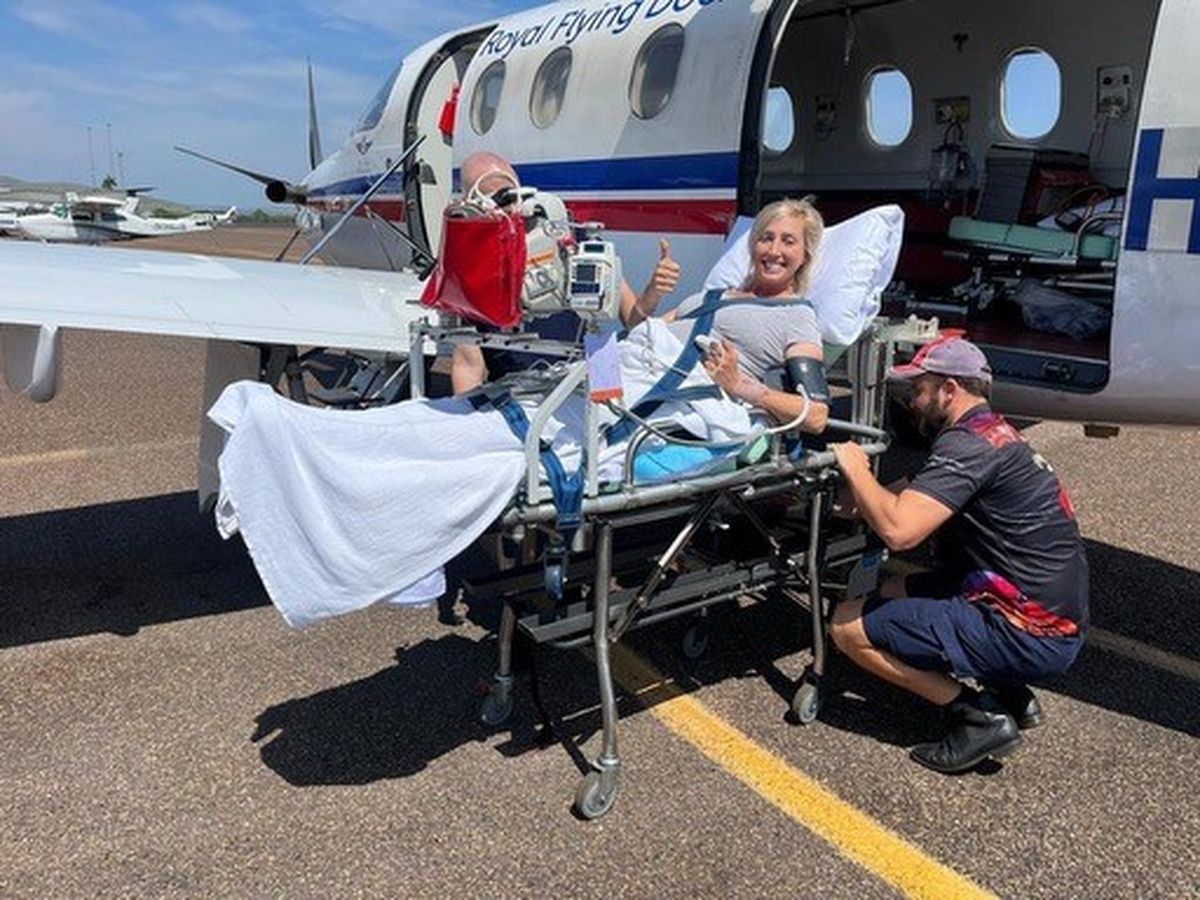 Ella on a stretcher outside of an RFDS PC-12