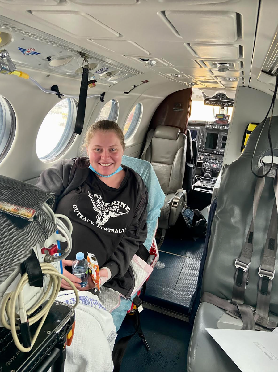 Hannah is pictured in an RFDS aircraft being airlifted to Toowoomba hospital