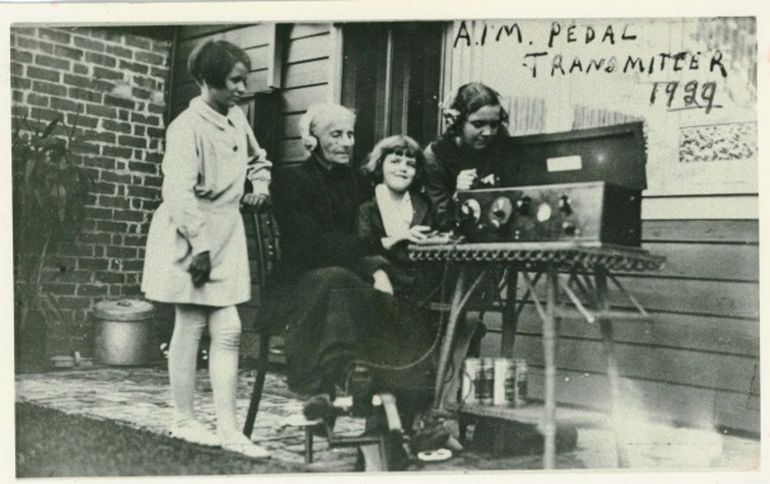 Lady using the pedal radio in 1929