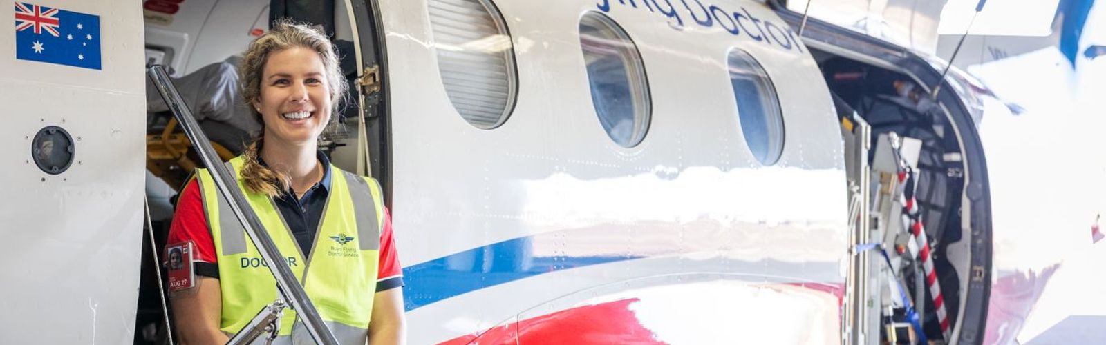 Dr Sophie Ootes pictured next to RFDS aircraft