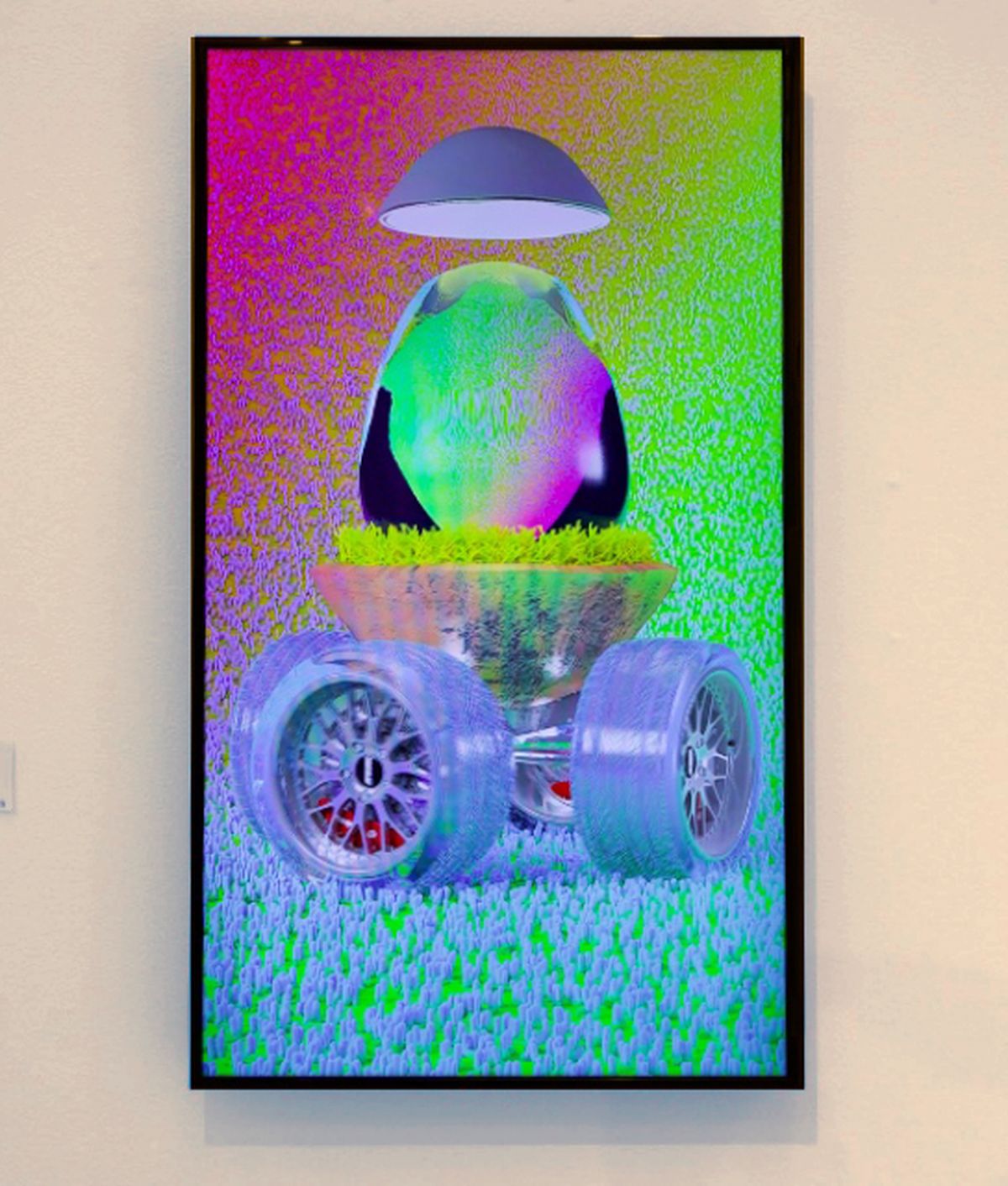 photo of a video screen showing a picture of a colourful egg on wheels