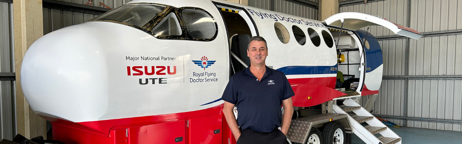 Stuart in front of aeromedical simulator