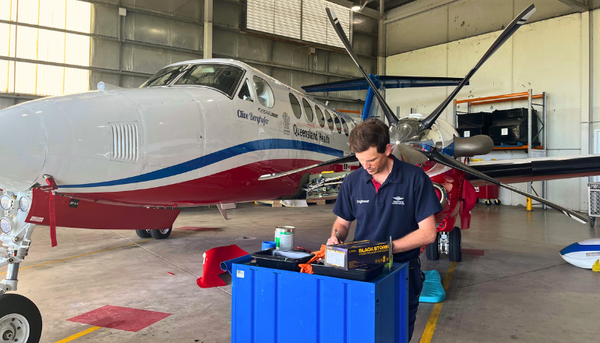 Engineer, Nic in working in front of aircraft