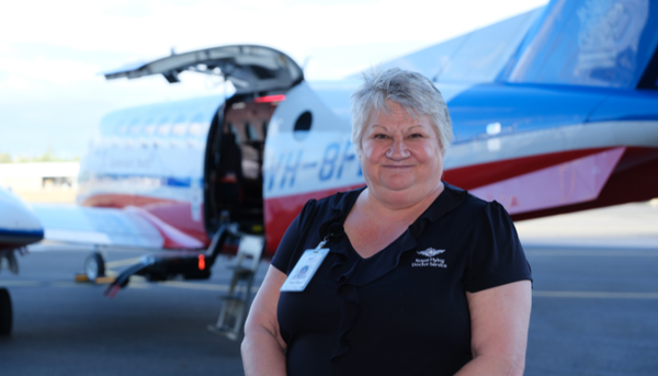 Trish in front of aircraft