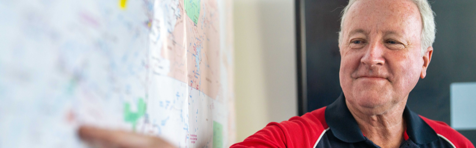 Operations Coordinator answering the phone on her headset.