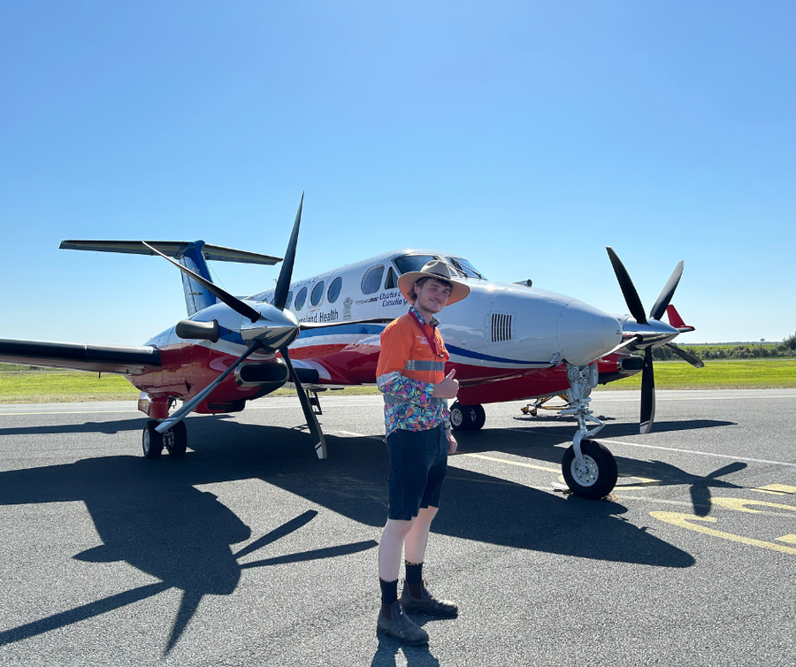 Sam in front of RFDS aircraft