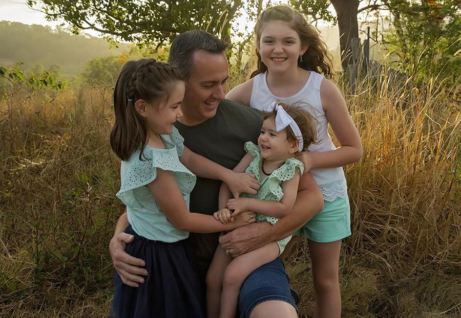 Royal Flying Doctor Service pilot Dave Collins with his daughters (L-R) Leni, 8, Ashleigh, 3, and Haylea, 10. Photo: Jamie T Photography.