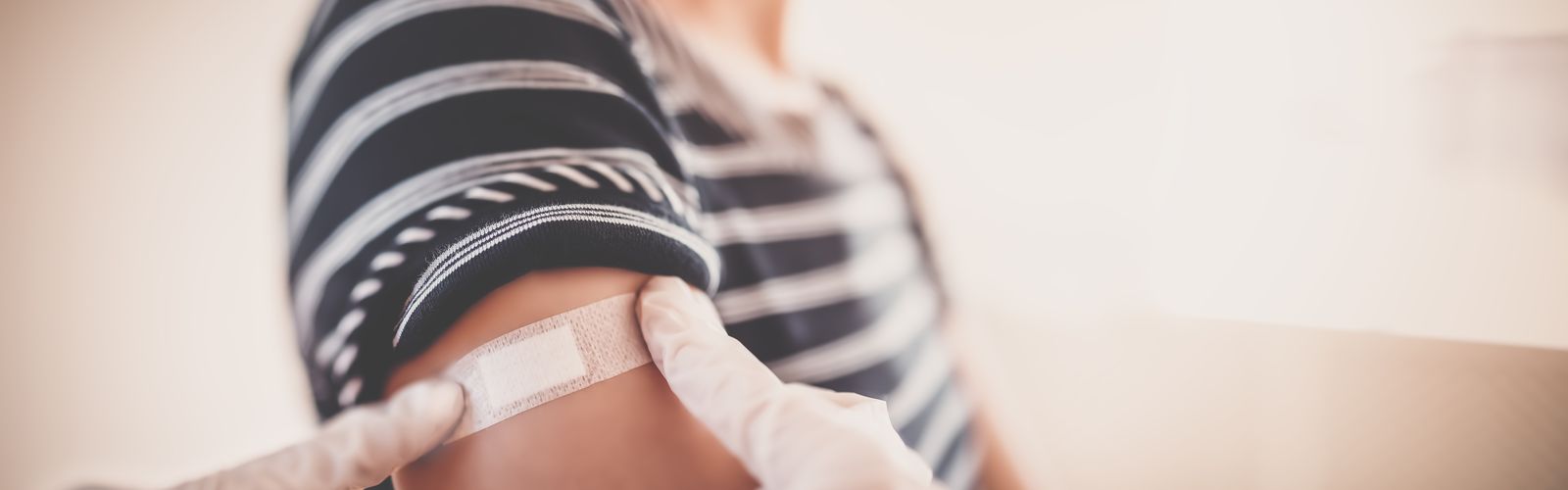 Plaster on arm after vaccination