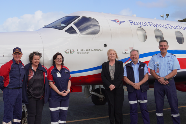 RFDS staff with a PC-12 bearing the Rinehart Medical Foundation logo