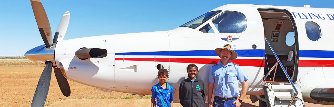 Pilot and patients in front of PC-12